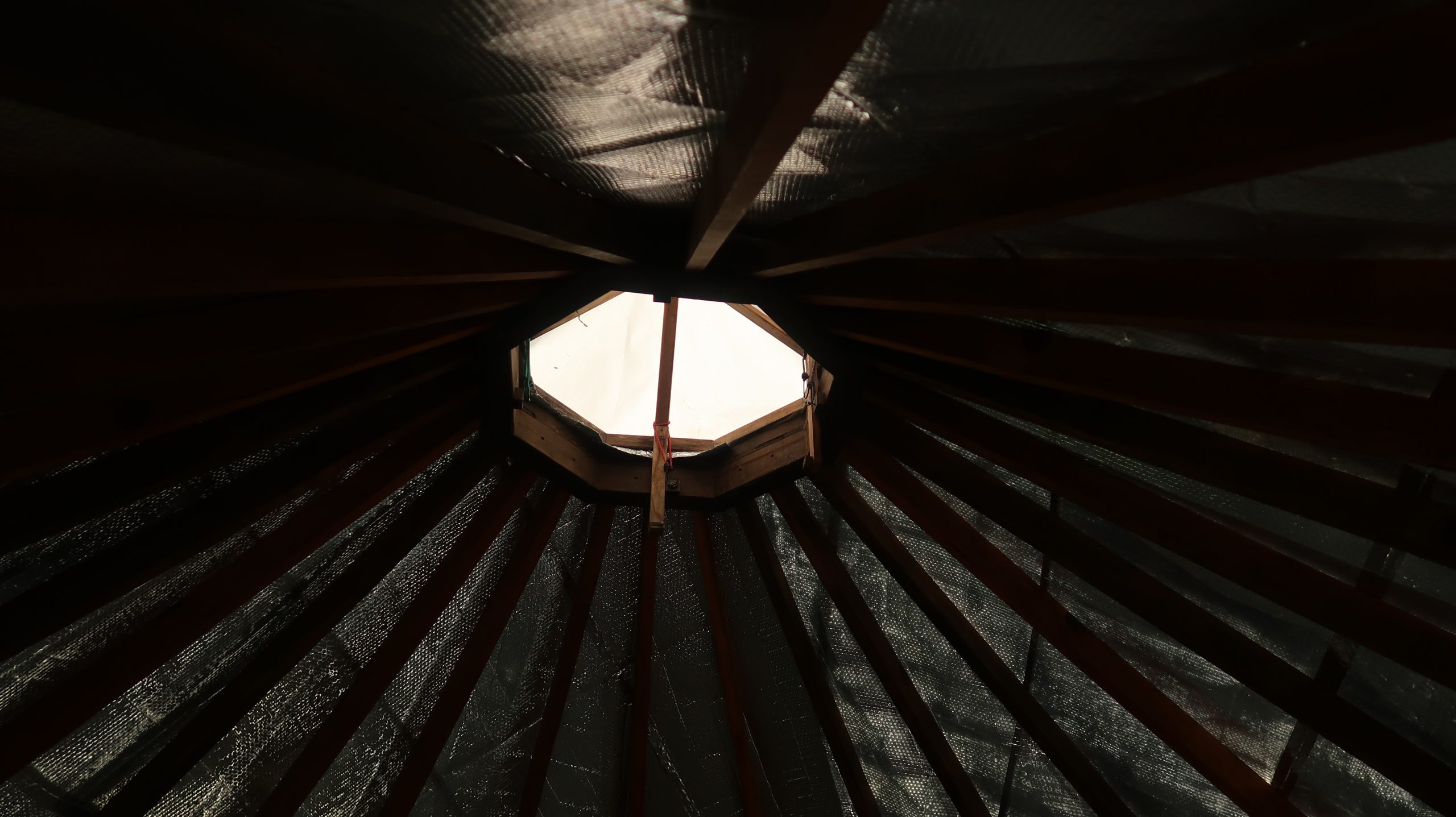 16 ft Yurt with subfloor, beams, and carpeting